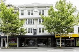 Edway Training and Training Aid's Darlinghurst centre: a white two-storey building with street trees in front and the shared shopfront at ground level.